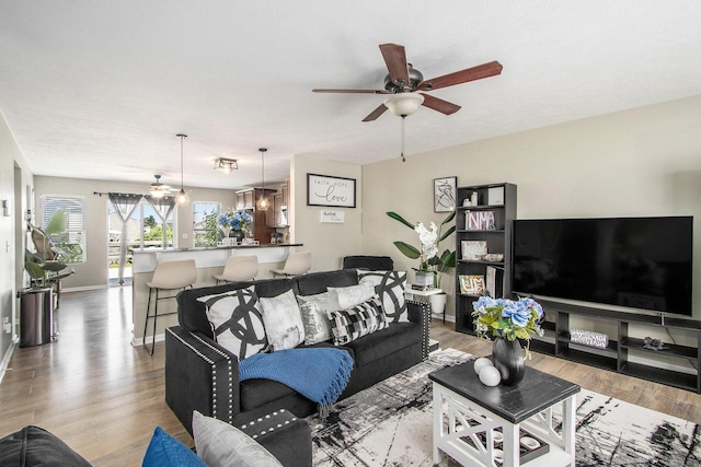 1619 Ives Mill Ln, Vicksburg, MI 49097 - living area with ceiling fan and light wood-style flooring