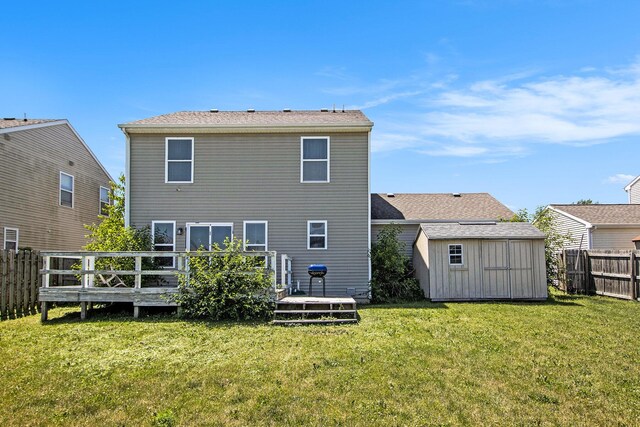 1619 Ives Mill Ln, Vicksburg, MI 49097 - back of house with a shed, a fenced backyard, and a deck