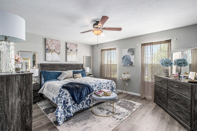1619 Ives Mill Ln, Vicksburg, MI 49097 - bedroom with light wood-style floors and a ceiling fan