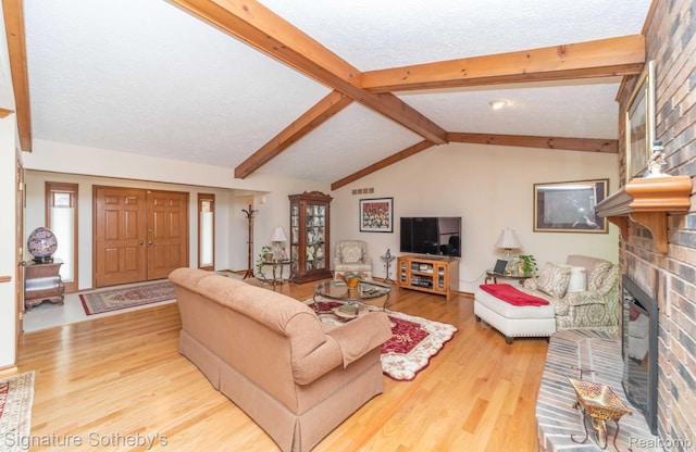 25759 Hunt Club Blvd, Farmington, MI 48335 - living room featuring wood finished floors, a brick fireplace, and a textured ceiling