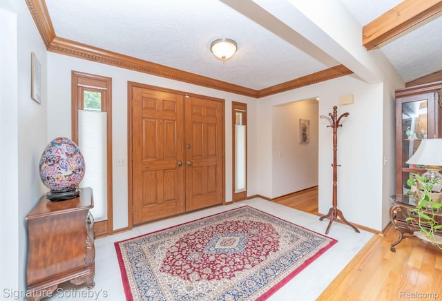 25759 Hunt Club Blvd, Farmington, MI 48335 - foyer entrance featuring a textured ceiling and ornamental molding