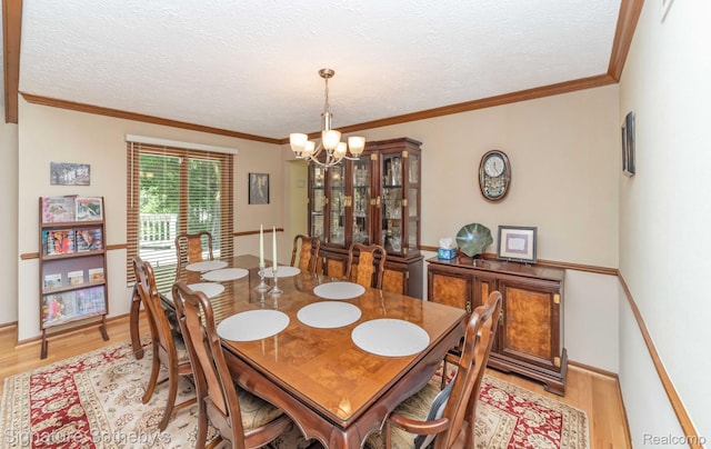25759 Hunt Club Blvd, Farmington, MI 48335 - dining area with light wood-style flooring, a chandelier, ornamental molding, and a textured ceiling