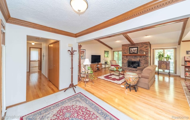 25759 Hunt Club Blvd, Farmington, MI 48335 - living room featuring a brick fireplace, a textured ceiling, wood finished floors, and ornamental molding