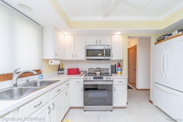 25759 Hunt Club Blvd, Farmington, MI 48335 - kitchen with stainless steel appliances, white cabinetry, light countertops, ornamental molding, and decorative backsplash