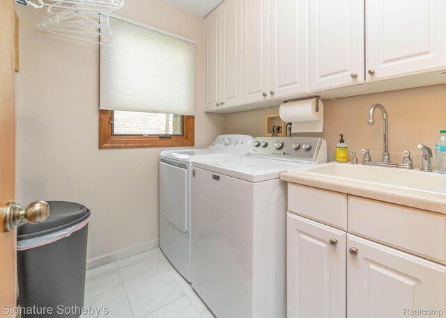 25759 Hunt Club Blvd, Farmington, MI 48335 - washroom with washing machine and clothes dryer, cabinet space, and light tile patterned floors