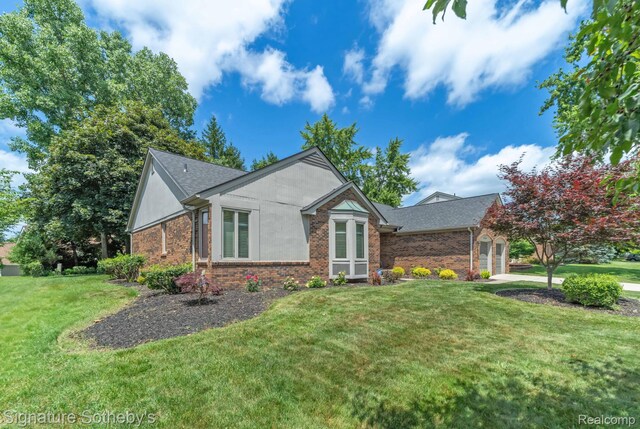 25759 Hunt Club Blvd, Farmington, MI 48335 - ranch-style home with a front lawn, brick siding, an attached garage, and roof with shingles