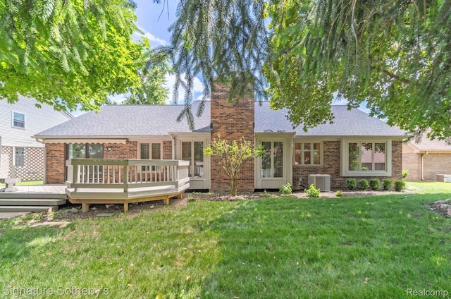 25759 Hunt Club Blvd, Farmington, MI 48335 - rear view of house with a chimney, a deck, brick siding, a yard, and roof with shingles