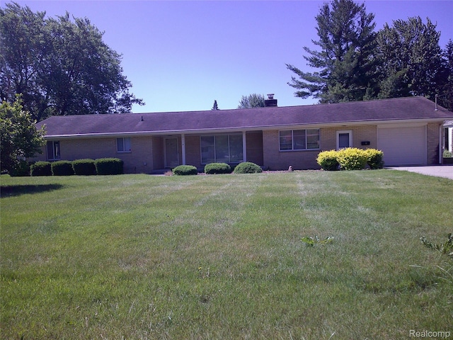 7776 Ash St, Birch Run, MI 48415 - ranch-style house featuring a garage, brick siding, a chimney, and a front yard