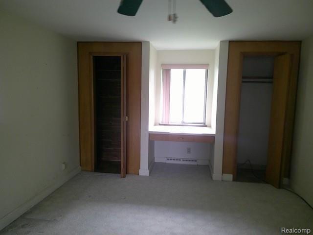 7776 Ash St, Birch Run, MI 48415 - unfurnished bedroom with carpet floors and ceiling fan