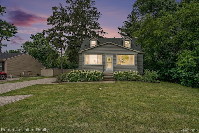 9309 Newburgh Rd, Livonia, MI 48150 - cape cod house featuring driveway and a gate