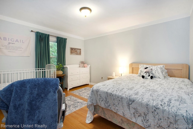 9309 Newburgh Rd, Livonia, MI 48150 - bedroom with wood finished floors and ornamental molding