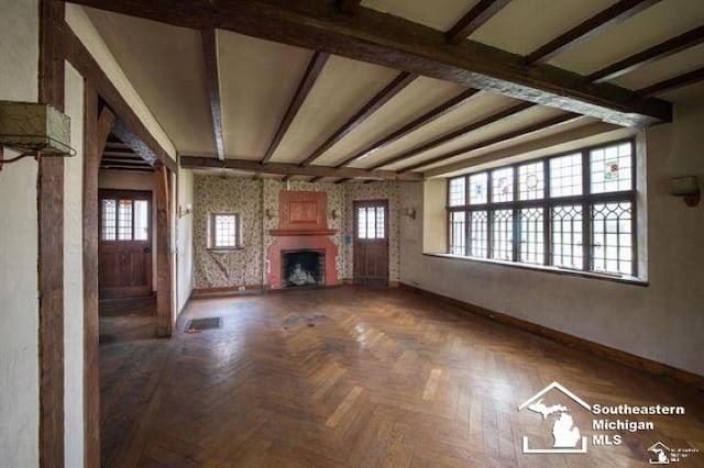 1989 W Grand Blvd, Detroit, MI 48208 - unfurnished living room with a fireplace and beam ceiling