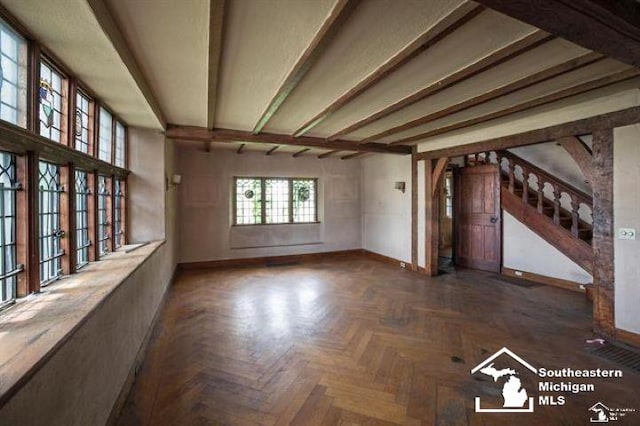 1989 W Grand Blvd, Detroit, MI 48208 - unfurnished living room with stairs and beam ceiling