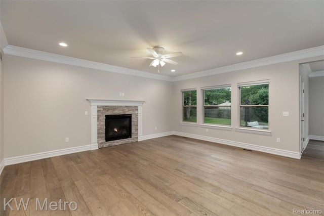 85 Hickory Dr, Troy, MI 48083 - unfurnished living room with a ceiling fan, hardwood / wood-style floors, a fireplace, crown molding, and recessed lighting