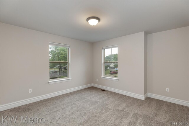 85 Hickory Dr, Troy, MI 48083 - unfurnished room with healthy amount of natural light and carpet