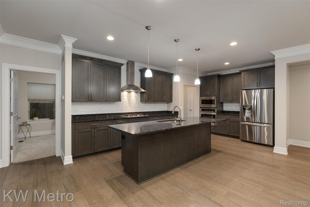 85 Hickory Dr, Troy, MI 48083 - kitchen featuring appliances with stainless steel finishes, wall chimney exhaust hood, crown molding, dark brown cabinets, and dark stone counters