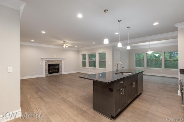 85 Hickory Dr, Troy, MI 48083 - kitchen featuring ceiling fan, dark stone counters, dark brown cabinets, crown molding, and recessed lighting