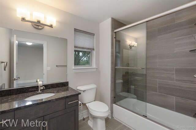 85 Hickory Dr, Troy, MI 48083 - full bath with vanity, shower / bath combination with glass door, and tile patterned flooring