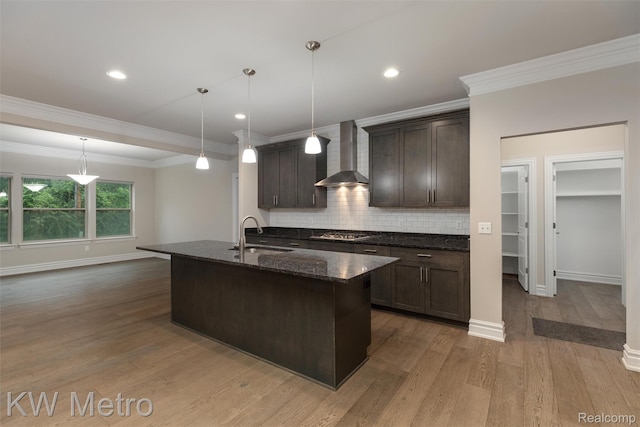 85 Hickory Dr, Troy, MI 48083 - kitchen with wall chimney exhaust hood, dark brown cabinets, stainless steel gas cooktop, decorative backsplash, and wood finished floors