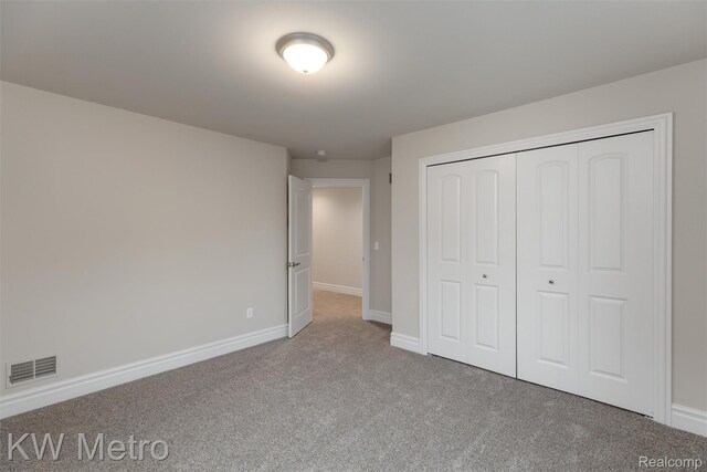 85 Hickory Dr, Troy, MI 48083 - unfurnished bedroom with carpet floors and a closet