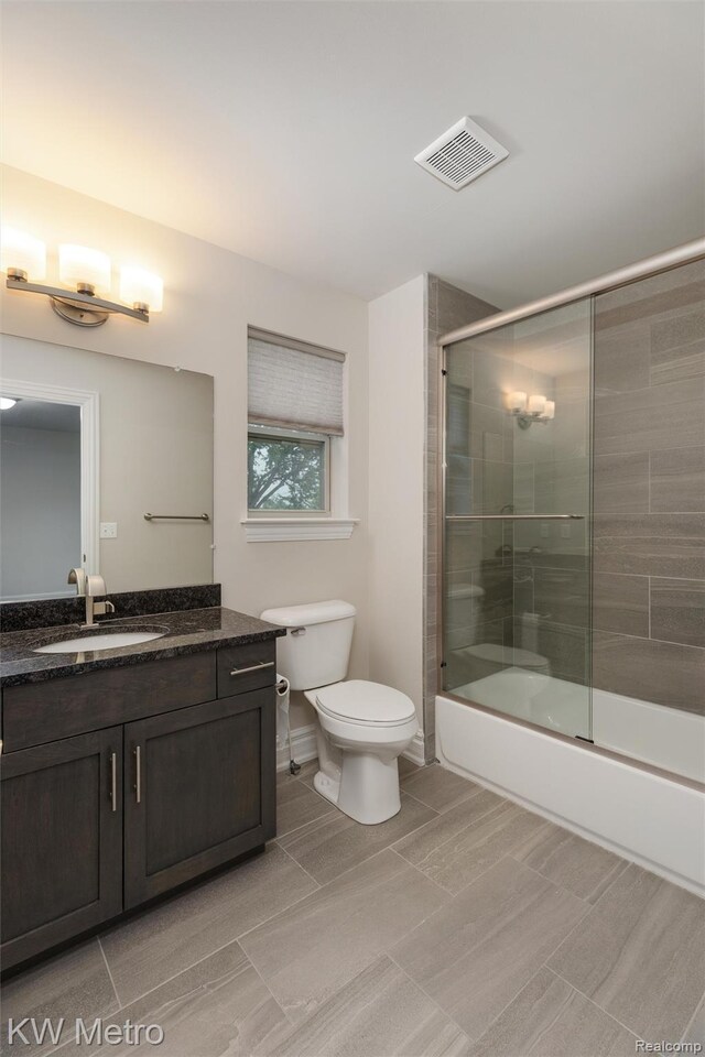 85 Hickory Dr, Troy, MI 48083 - bathroom featuring vanity and combined bath / shower with glass door