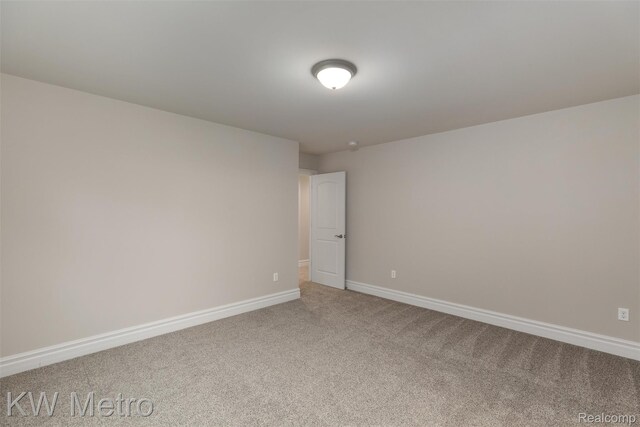 85 Hickory Dr, Troy, MI 48083 - spare room featuring light carpet and baseboards