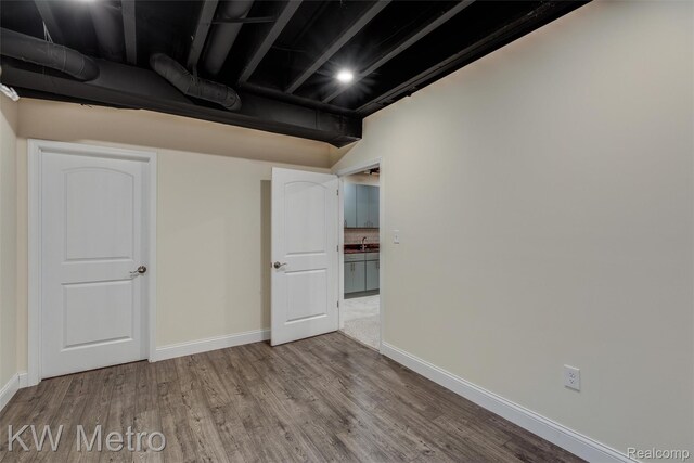 85 Hickory Dr, Troy, MI 48083 - below grade area featuring wood finished floors and baseboards