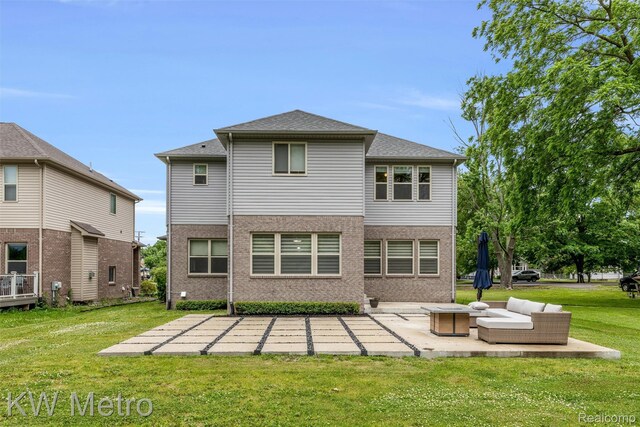 85 Hickory Dr, Troy, MI 48083 - rear view of house featuring a patio area, a yard, and brick siding