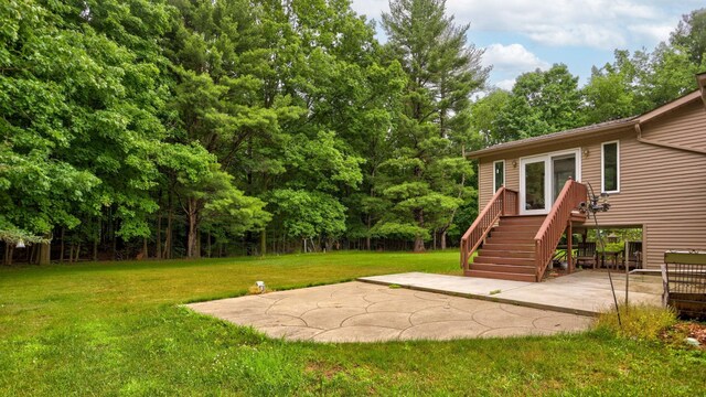 5852 Pinkerton Rd, Vassar, MI 48768 - view of grassy yard with a patio and view of scattered trees