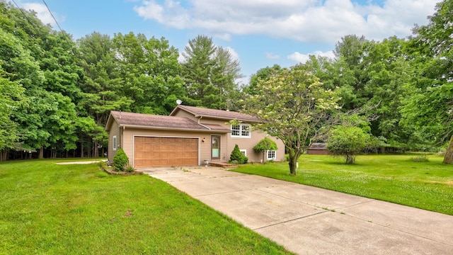 5852 Pinkerton Rd, Vassar, MI 48768 - tri-level home featuring a front yard, a garage, and driveway