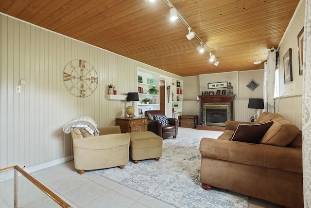 5852 Pinkerton Rd, Vassar, MI 48768 - tiled living area with rail lighting, a fireplace, wooden ceiling, and wood walls