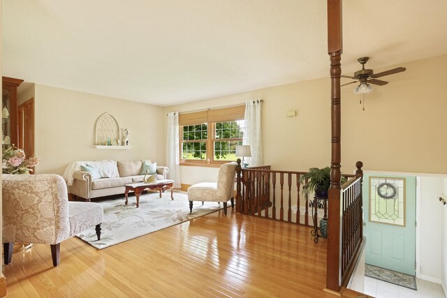 5852 Pinkerton Rd, Vassar, MI 48768 - living room with a ceiling fan and light wood-style floors