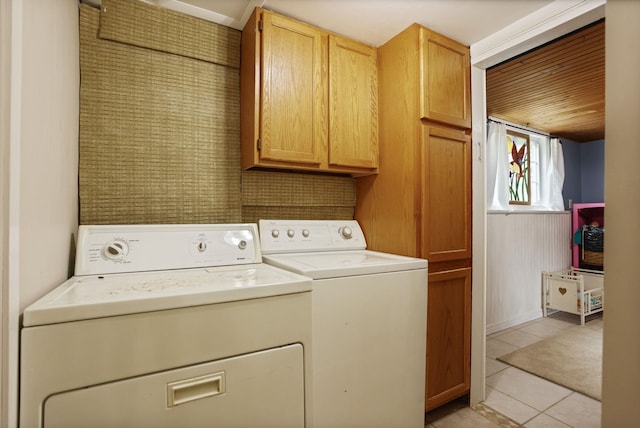 5852 Pinkerton Rd, Vassar, MI 48768 - laundry room featuring cabinet space, washer and dryer, and light tile patterned flooring