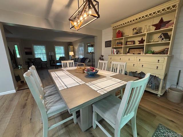171 Golfview Dr, Caro, MI 48723 - dining space with wood finished floors and a chandelier
