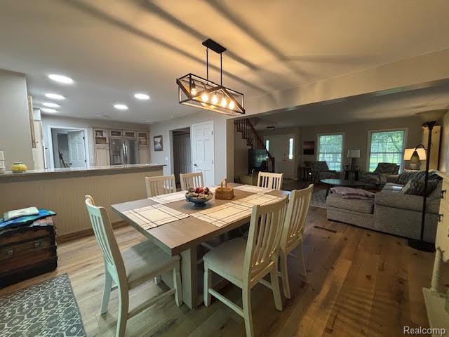 171 Golfview Dr, Caro, MI 48723 - dining room with stairs, light wood-type flooring, and recessed lighting