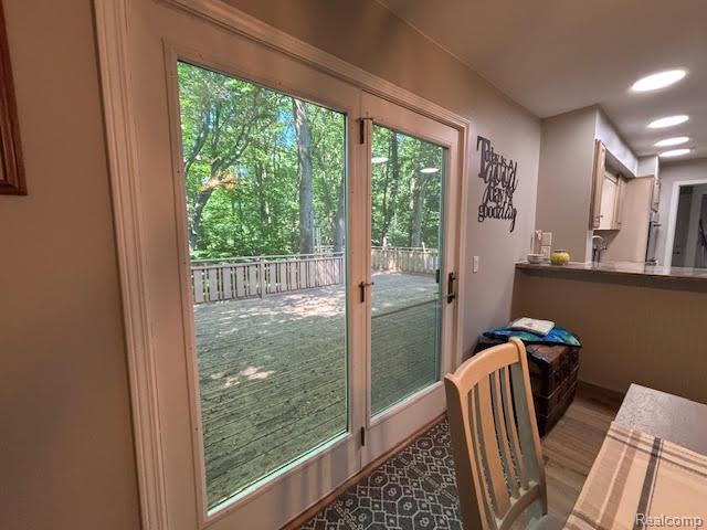 171 Golfview Dr, Caro, MI 48723 - doorway to outside with plenty of natural light and wood finished floors