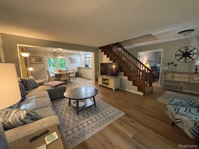 171 Golfview Dr, Caro, MI 48723 - living area featuring wood finished floors and stairway