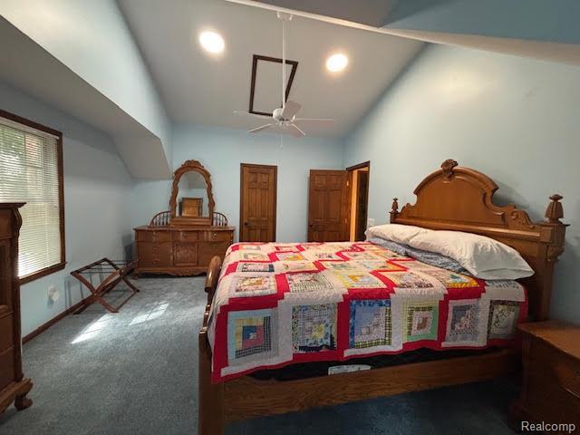 171 Golfview Dr, Caro, MI 48723 - bedroom with carpet flooring, lofted ceiling, a closet, and a ceiling fan