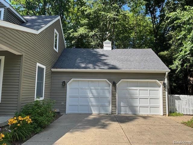 171 Golfview Dr, Caro, MI 48723 - garage featuring driveway