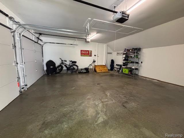 171 Golfview Dr, Caro, MI 48723 - garage with a garage door opener