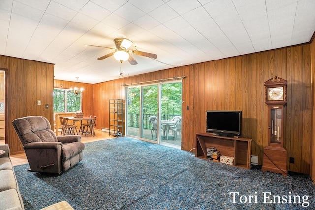 4366 Woods Rd, Sidney, MI 48885 - carpeted living room featuring ceiling fan, a chandelier, and wooden walls
