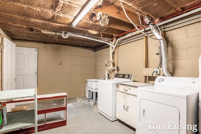 4366 Woods Rd, Sidney, MI 48885 - washroom with washer and dryer and concrete block wall