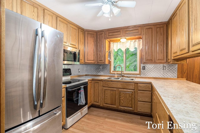 4366 Woods Rd, Sidney, MI 48885 - kitchen with appliances with stainless steel finishes, brown cabinets, and decorative backsplash