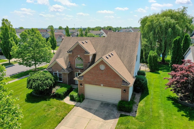 2683 Mystic Dr, Ann Arbor, MI 48103 - traditional-style house with brick siding, an attached garage, driveway, roof with shingles, and a front lawn