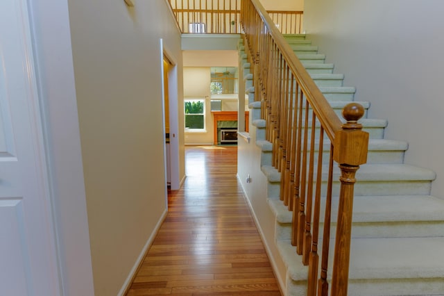 2683 Mystic Dr, Ann Arbor, MI 48103 - staircase featuring hardwood / wood-style floors and a fireplace