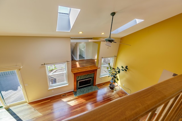 2683 Mystic Dr, Ann Arbor, MI 48103 - living area with a skylight, recessed lighting, wood finished floors, a fireplace, and ceiling fan
