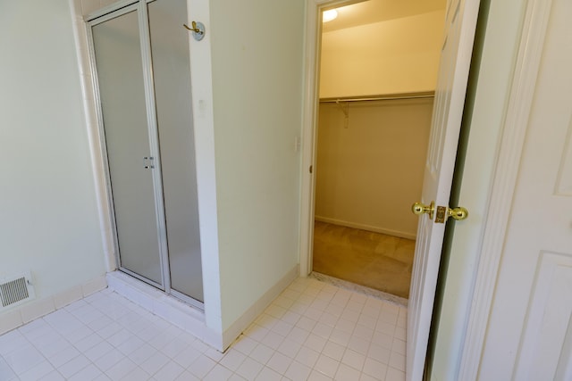 2683 Mystic Dr, Ann Arbor, MI 48103 - full bath with a stall shower, tile patterned flooring, and a walk in closet