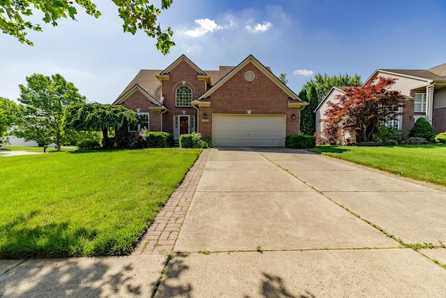 2683 Mystic Dr, Ann Arbor, MI 48103 - traditional home featuring brick siding, an attached garage, a front yard, and driveway