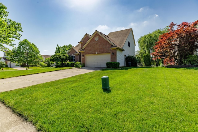 2683 Mystic Dr, Ann Arbor, MI 48103 - traditional-style home with brick siding, a garage, driveway, and a front lawn