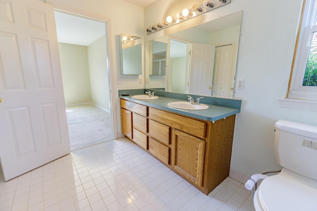 2683 Mystic Dr, Ann Arbor, MI 48103 - full bathroom with double vanity and tile patterned flooring